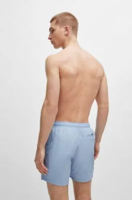 Bañador tipo shorts con forro integral y logo estampado