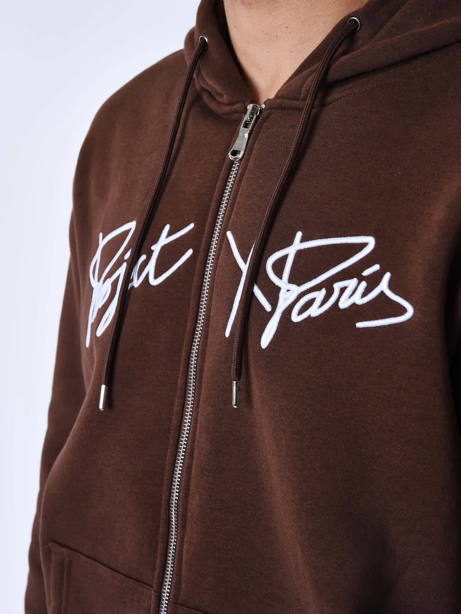 Chaqueta con cremallera y capucha Origin con bordado