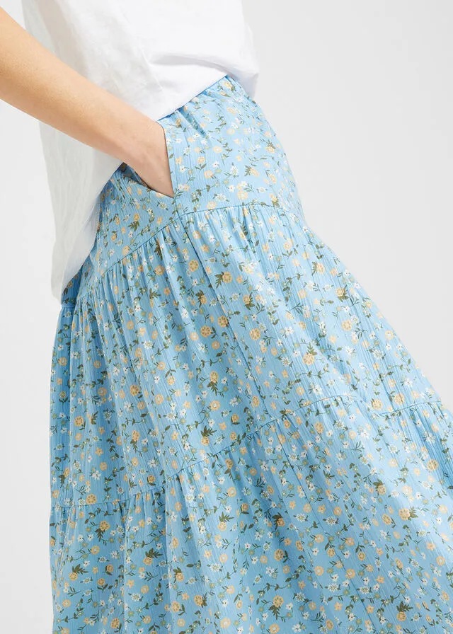 Falda larga con volantes azul claro con flores