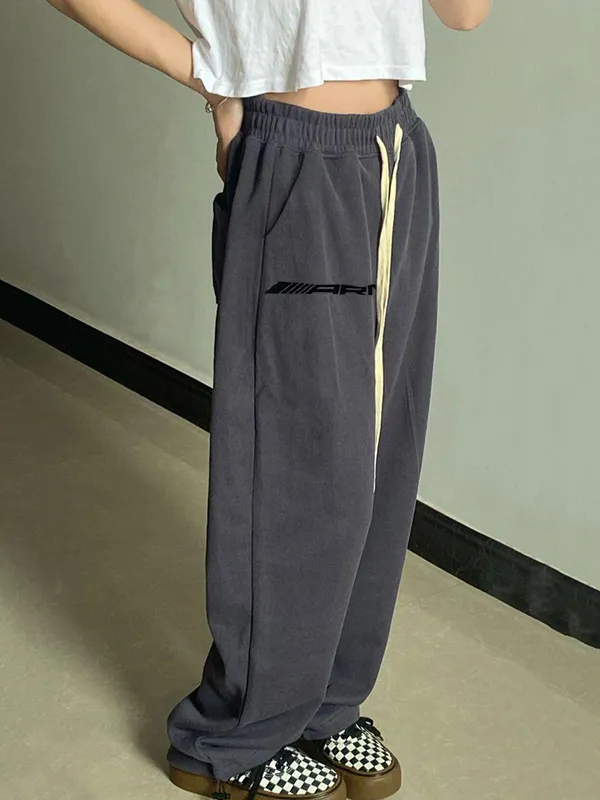 Pantalones deportivos con cordones y estampado de letras