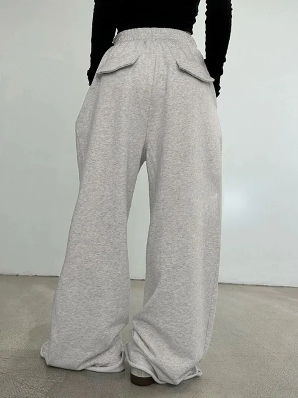 Pantalones deportivos con detalle de solapa unicolor