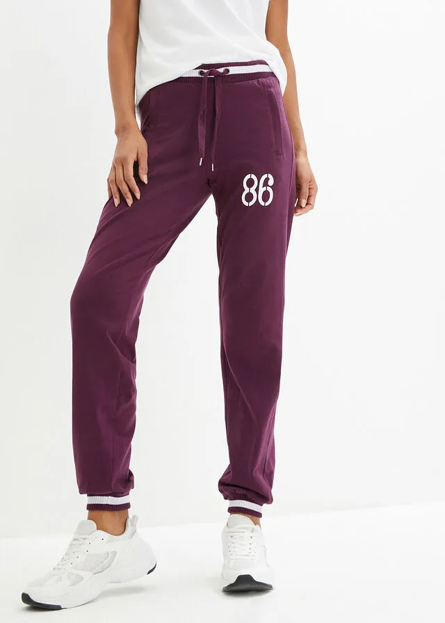 Pantalón deportivo con bolsillos con cierre morado intenso