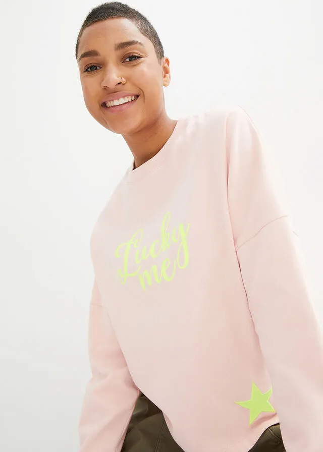 Sudadera rosa melocotón