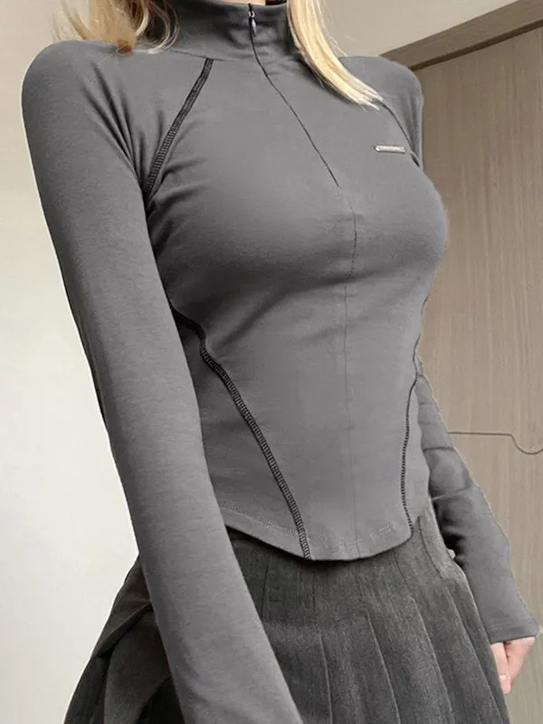 Top de manga larga con detalle de puntadas