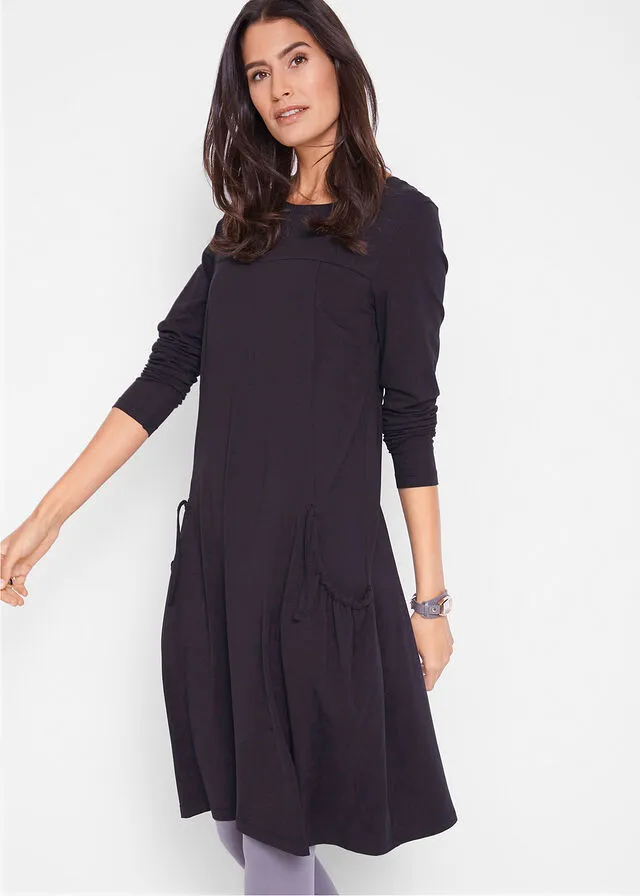 Vestido extragrande con bolsillos, con vuelo Negro